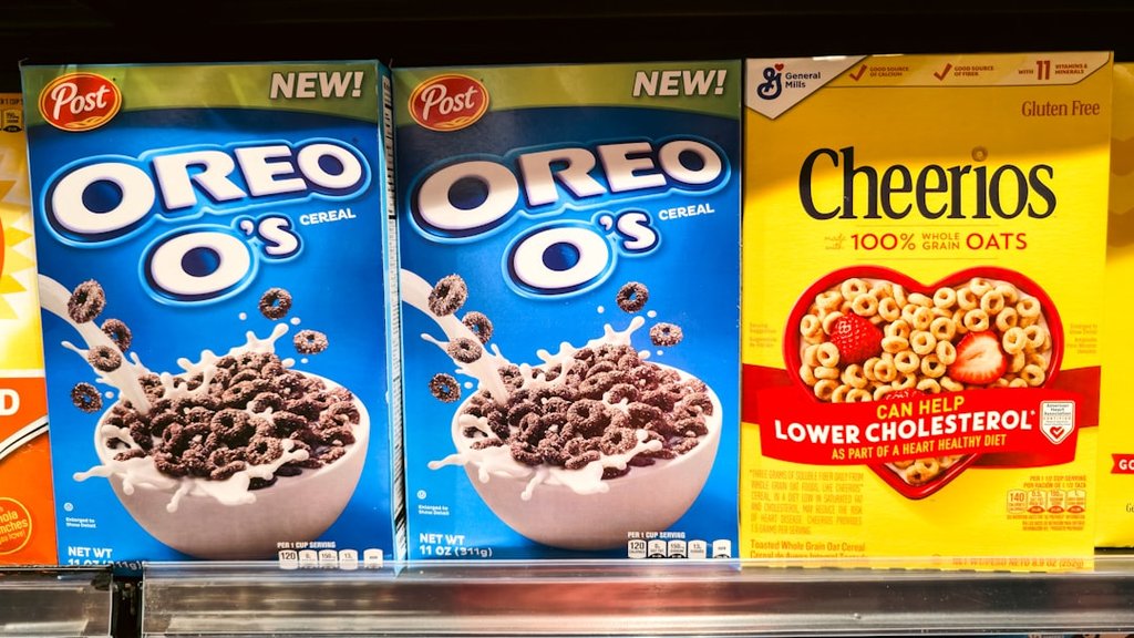 Cereal - Photograph of stacked cereal boxes featuring Oreo O’s and Cheerios, two popular breakfast cereals found in grocery stores. The image captures the colorful packaging and branding of these iconic products, often enjoyed with milk as part of a morning meal or snack. Perfect for illustrating breakfast culture, retail displays, and food marketing.