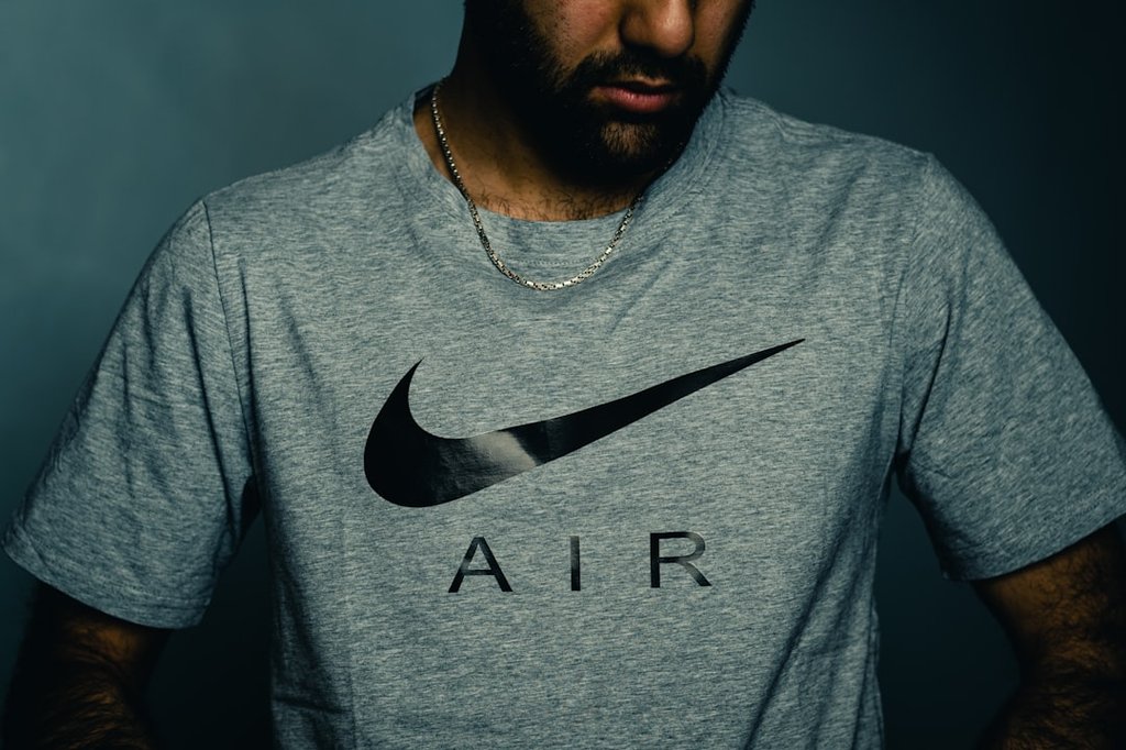 Nike - man in gray crew neck shirt
